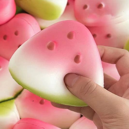 Squishy watermelon stress toy in hand, perfect for stress relief and fun fidgeting.