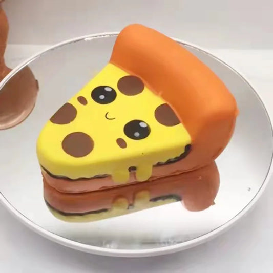 Cute pizza slice squishy toy with a smiling face and colorful toppings for sensory play