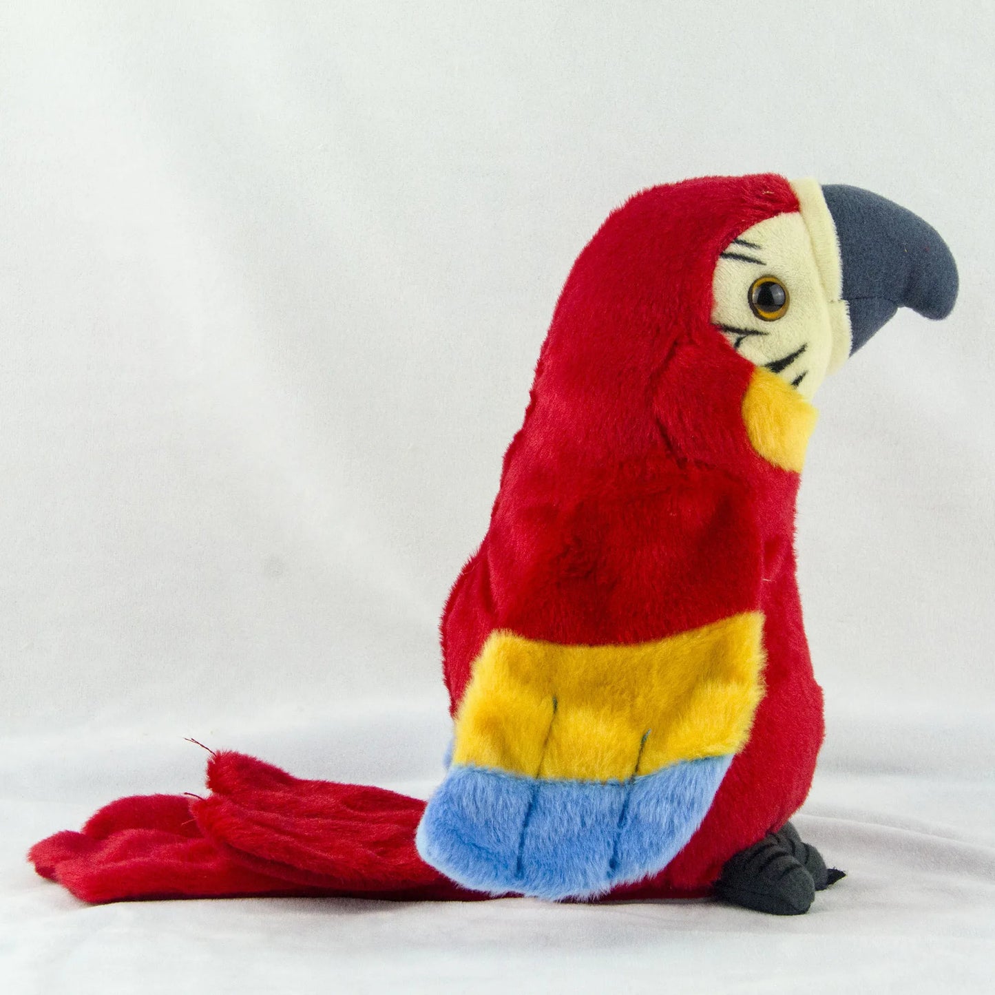 Colorful plush talking macaw parrot toy with vibrant red and yellow feathers for interactive play