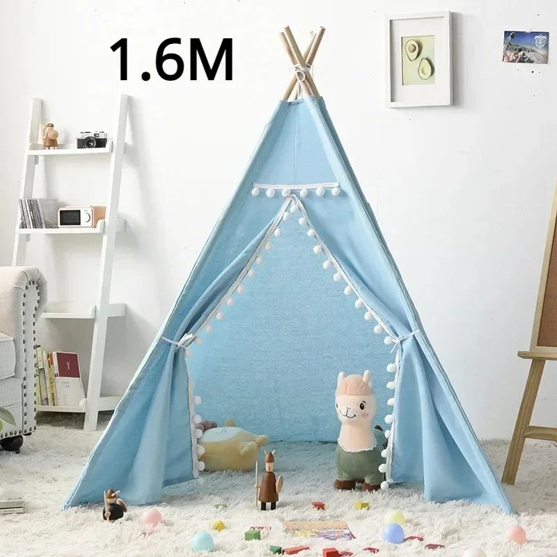 Blue teepee play tent for children with decorative pom poms and stuffed animals inside