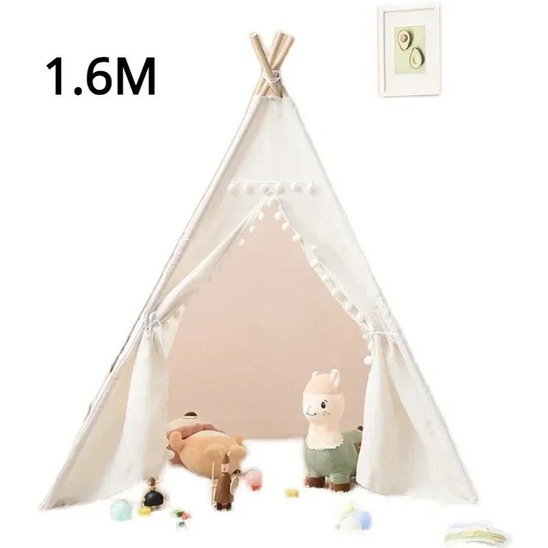 White teepee play tent for children with decorative pom poms and plush toys inside