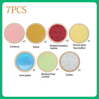 7-piece therapeutic touch activity toy set featuring various textures like corduroy and velvet