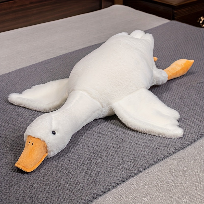 White goose plush toy by Active Playthings lying flat with soft white body and orange beak and feet