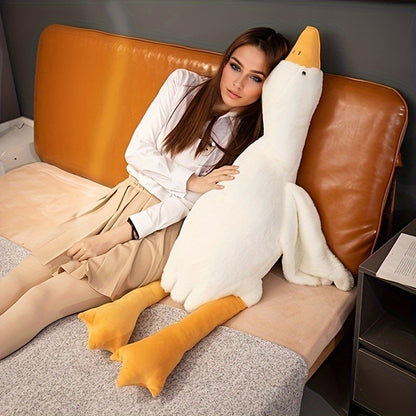 White goose plush toy by Active Playthings large soft stuffed animal next to woman on couch