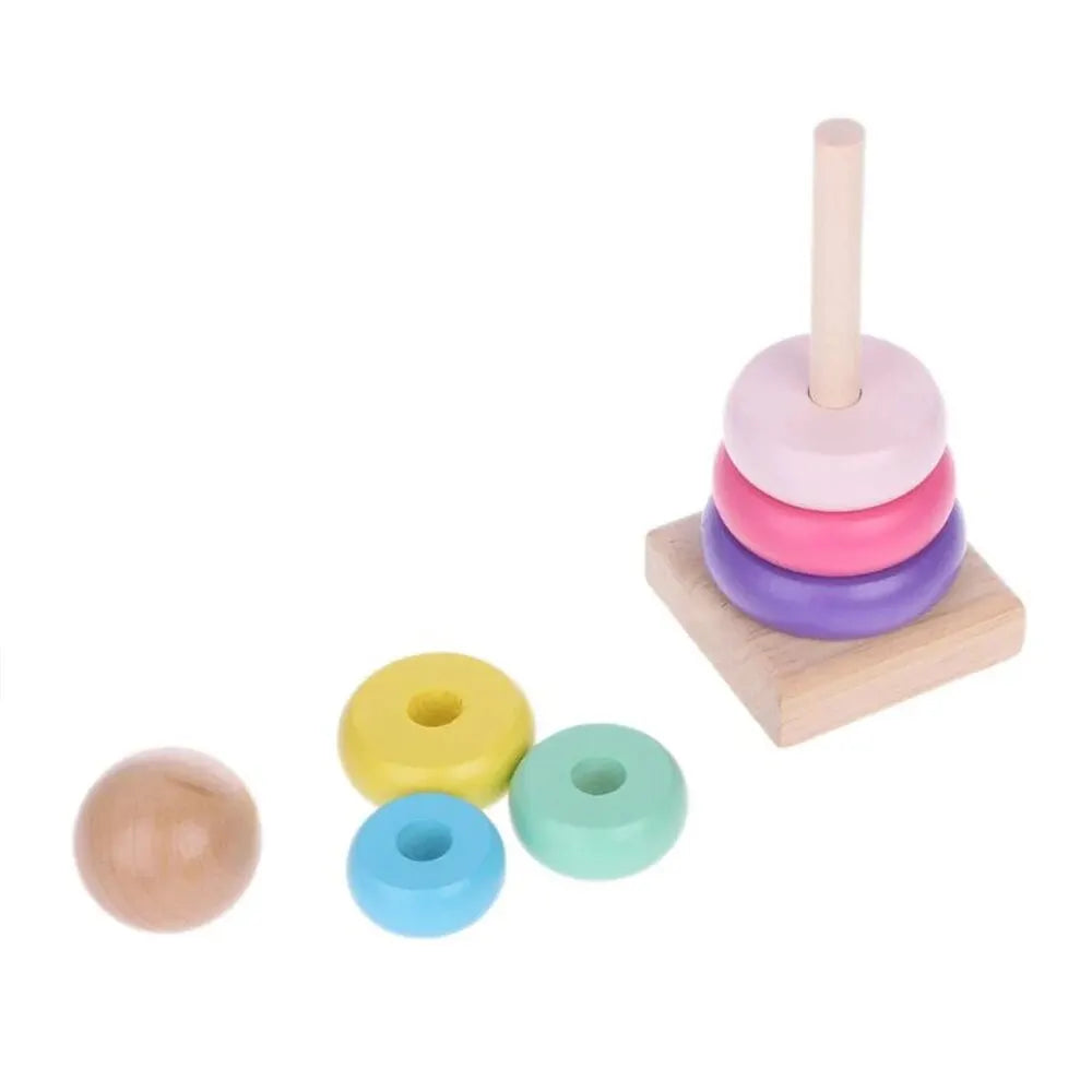 Colorful wooden rainbow stacking tower with five rings and a wooden base for children's playtime